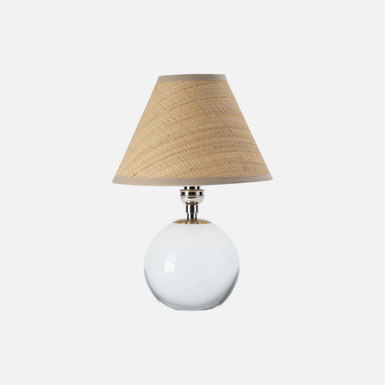 Citrine Home Giorgio mini table lamp featuring a clear glass spherical base and a natural woven rattan lampshade.