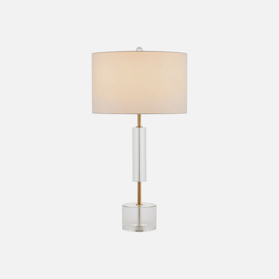Citrine Home Deville table lamp featuring a clear crystal base, brass accents, and a neutral fabric drum shade.