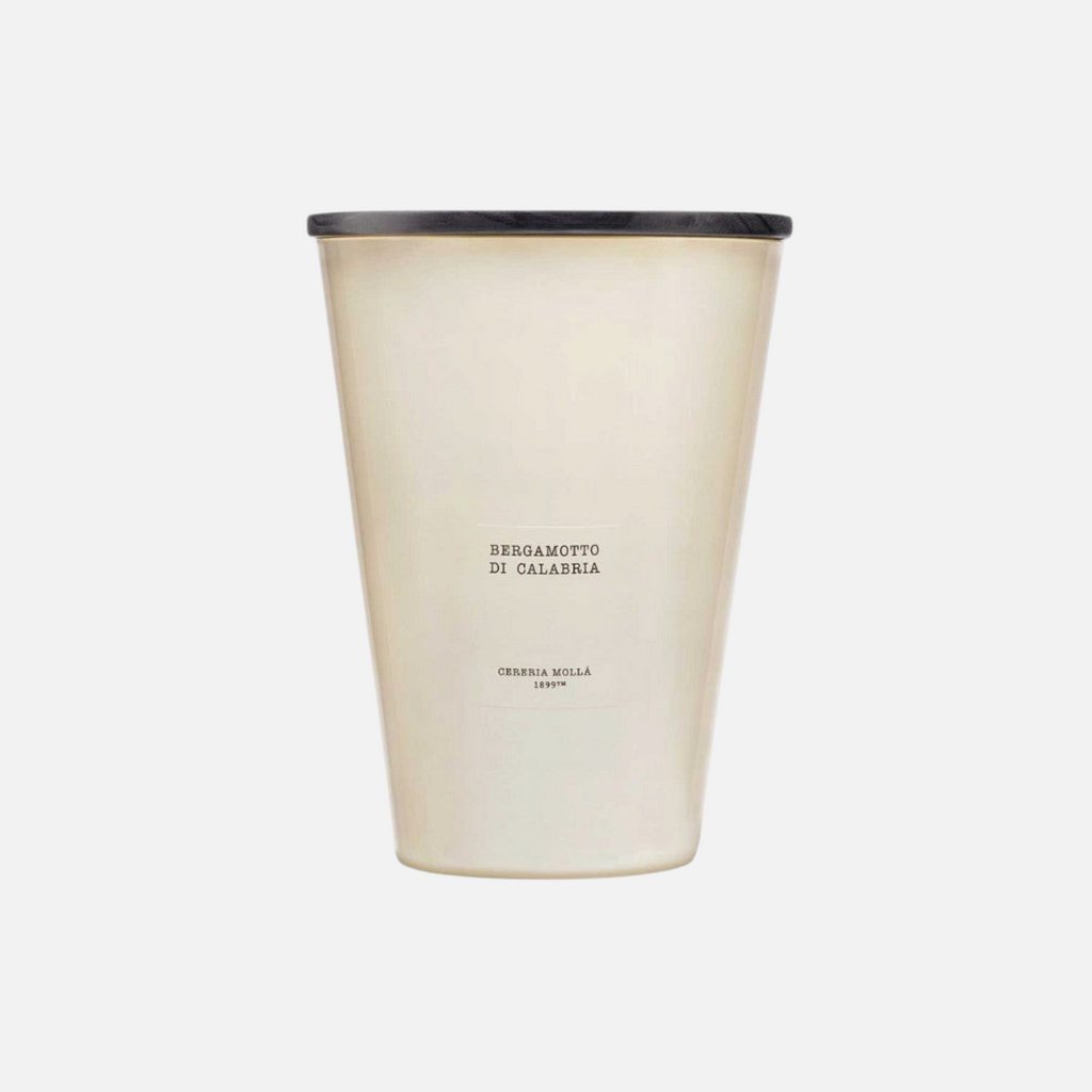 Citrine Home Bergamotto di Calabria 7.7 lb scented candle in a large beige glass vessel with a black wooden lid