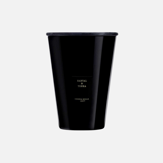Citrine Home Santal & Tonka 7.7 lb luxury scented candle in a sleek black glass vessel with a matching lid.