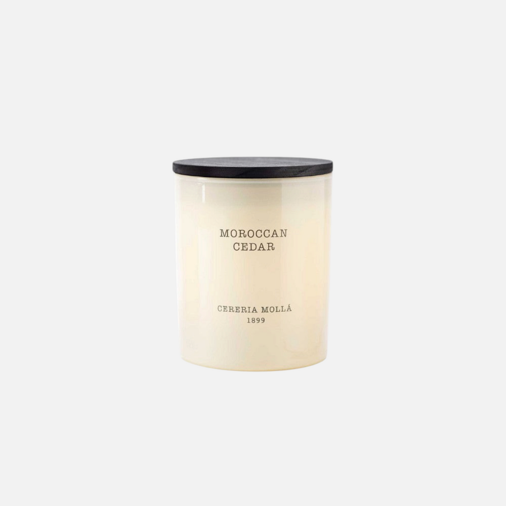 Citrine Home Moroccan Cedar 8 oz scented candle in a cream glass jar with a black wooden lid