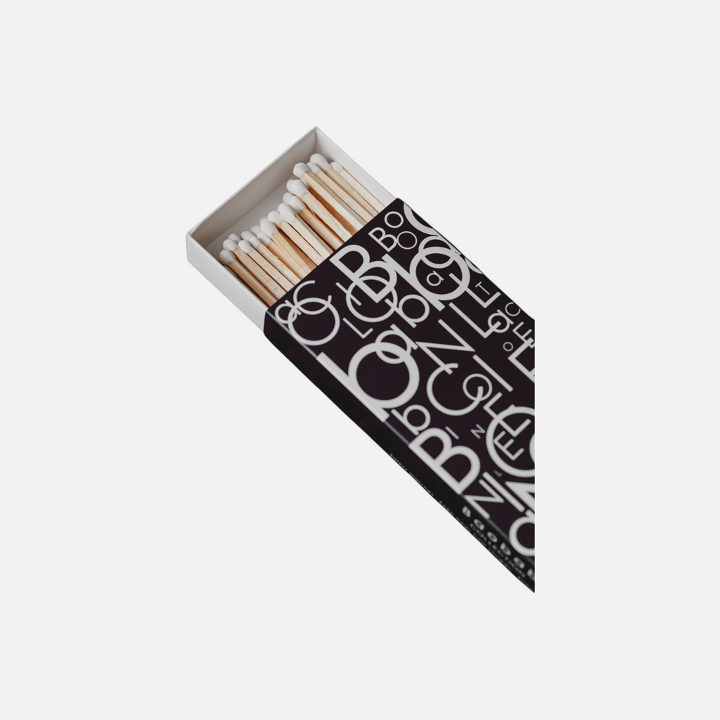 Citrine Home Letters matchbox with black and white graphic typography pattern and white-tipped matches