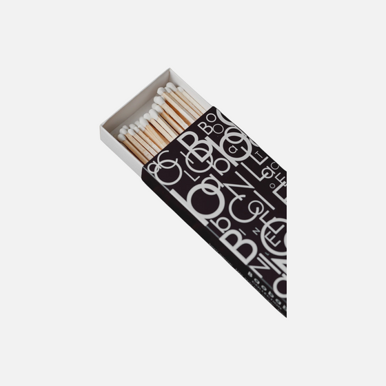 Citrine Home Letters matchbox with black and white graphic typography pattern and white-tipped matches