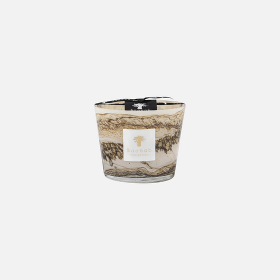 Citrine Home Sand Siloli hand-blown glass candle with beige and brown horizontal lines and organic speckle details.