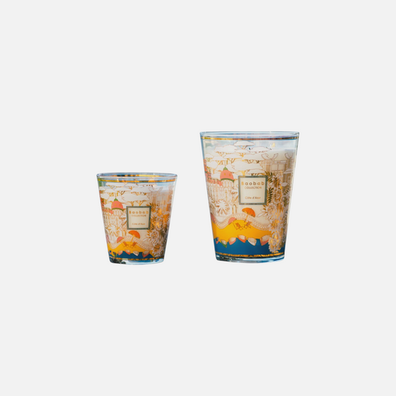 Citrine Home Cote D' Azur scented candles in glass jars with Mediterranean architectural illustrations by the sea.