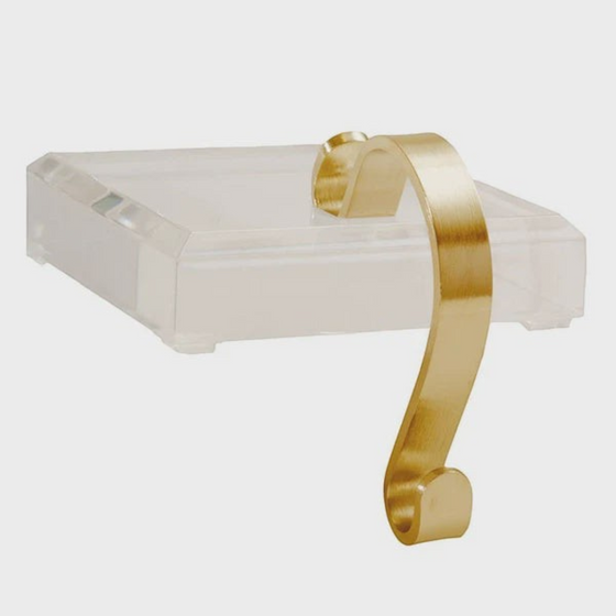 Citrine Home acrylic stocking holder with a brushed gold metal hook for modern holiday mantel decor.