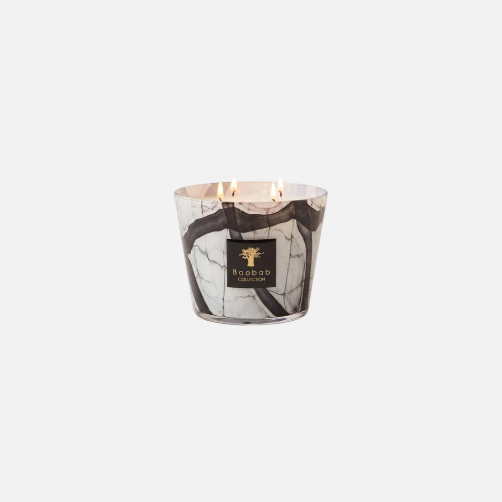 Citrine Home Stones Marble scented candle in a hand-blown glass vessel with grey and black marble-effect patterns.