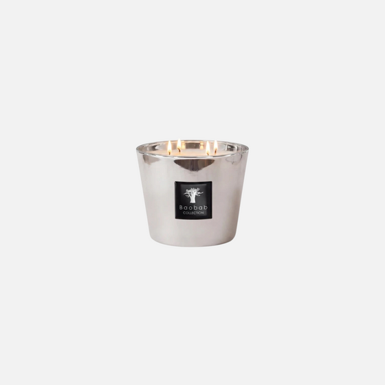 Citrine Home Les Exclusives Platinum scented candle in a metallic silver glass vessel with four burning wicks.