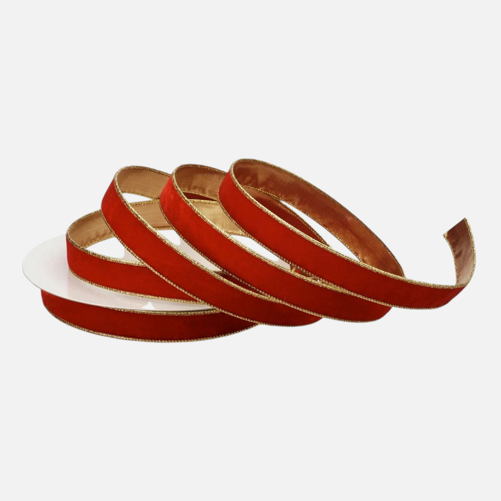 Citrine Home 1-inch red velvet ribbon on a spool featuring a decorative metallic gold edge for holiday crafting.