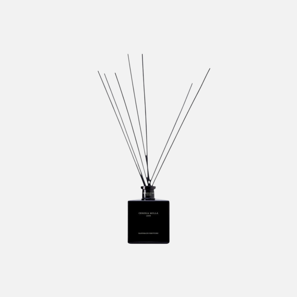 Citrine Home Bulgarian Rose & Oud reed diffuser in a sleek black square glass bottle with black reeds.