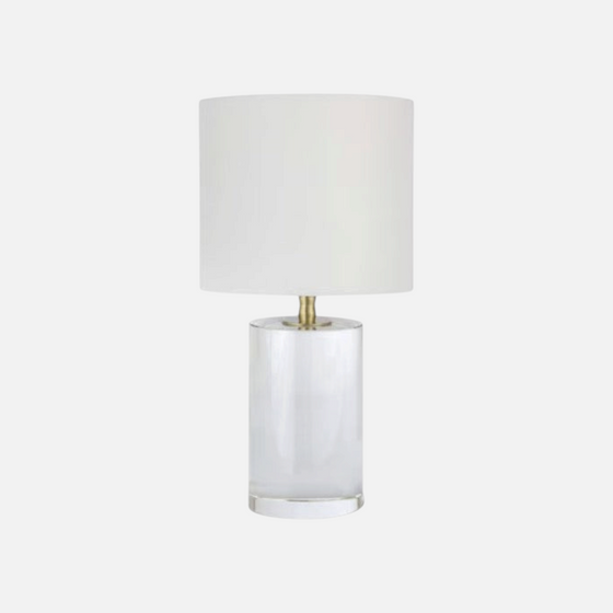 Citrine Home Juliet small table lamp with a clear cylindrical crystal base and a simple white fabric drum shade.