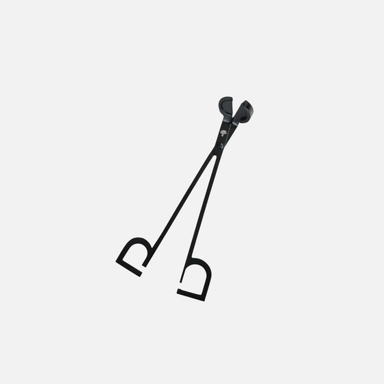 Citrine Home 7-inch matte black metal wick trimmer for candle maintenance on a light wood surface