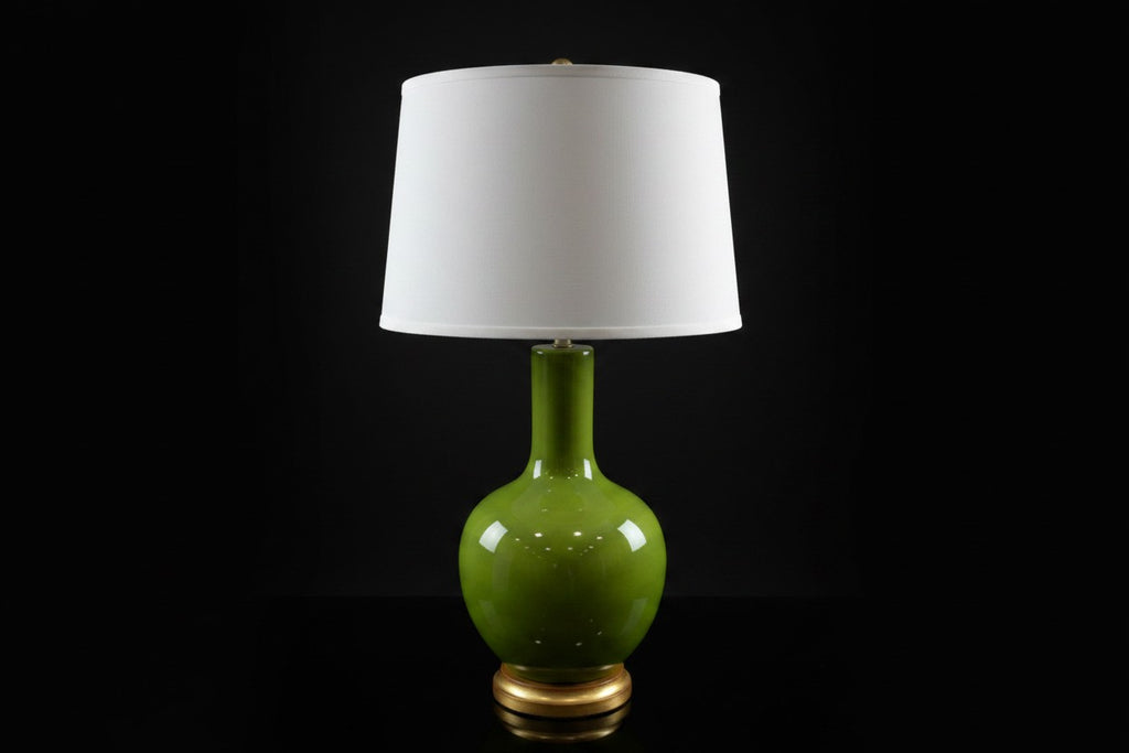 Citrine Home vintage apple green crackle glaze porcelain bottle lamp with a white drum shade and gilt base.