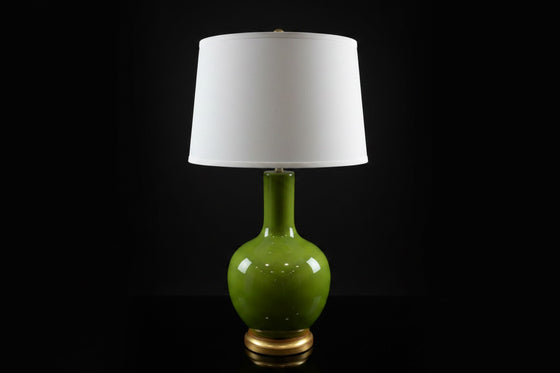 Citrine Home vintage apple green crackle glaze porcelain bottle lamp with a white drum shade and gilt base.