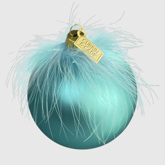 Citrine Home aqua mouth-blown glass Christmas ornament with delicate feathers and a gold hanging tag