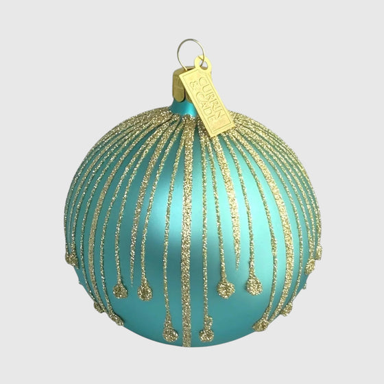 Citrine Home mouth-blown glass Christmas ornament in aqua with hand-painted gold glitter drip details.