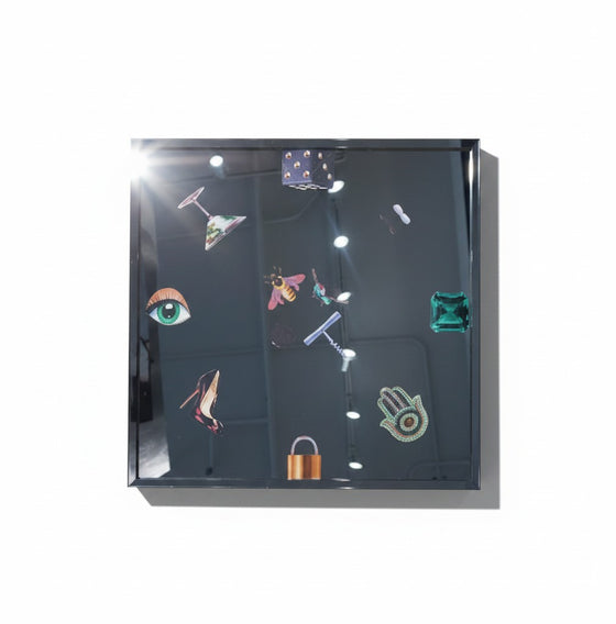 Citrine Home 18x18 black acrylic tray featuring a mirrored surface with decorative icons like a bee and eye.