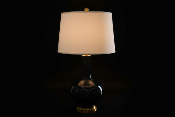 Citrine Home vintage black crackle glaze porcelain bottle lamp with a gold gilt base and white drum shade.