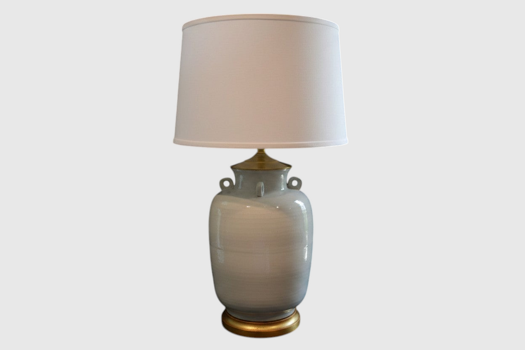 Citrine Home vintage Blanc de Chine jar lamp featuring a white glazed ceramic body, loop handles, and a gilt base.