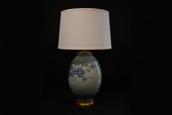 Citrine Home vintage blue and white porcelain ginger jar lamp with a white drum shade on a black background