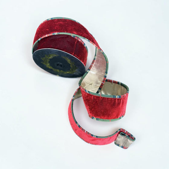 Citrine Home burgundy velvet ribbon featuring a decorative plaid trim edge, 2.5 inches wide on a spool.