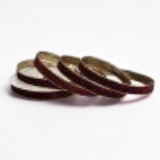 Citrine Home 1-inch burgundy velvet ribbon with a metallic gold edge, coiled on a white background.