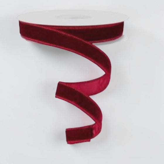Citrine Home burgundy velvet holiday ribbon on a spool, 7/8 inch wide, perfect for festive gift wrapping and decor.