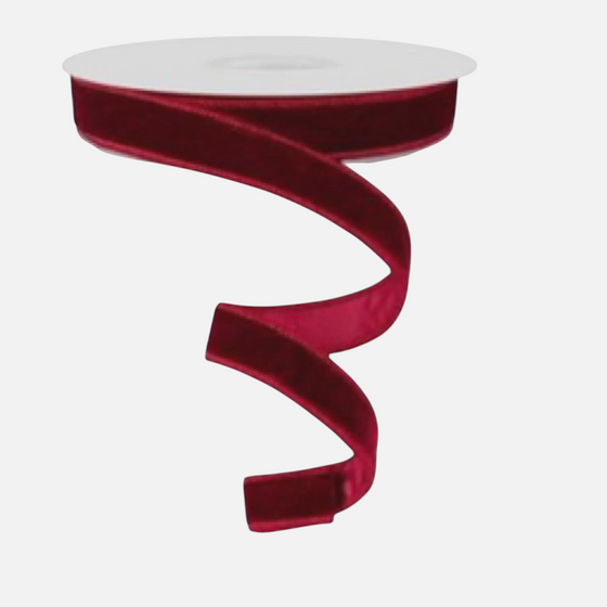 Citrine Home burgundy velvet holiday ribbon on a spool, 7/8 inch wide, perfect for festive gift wrapping and decor.