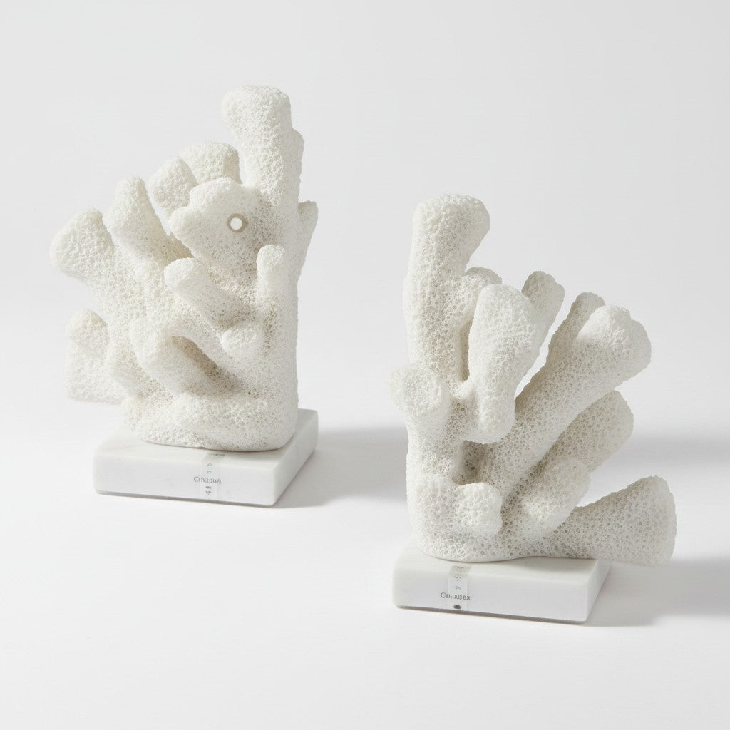 Citrine Home Charbel white faux coral bookends set on clear crystal bases for coastal decor
