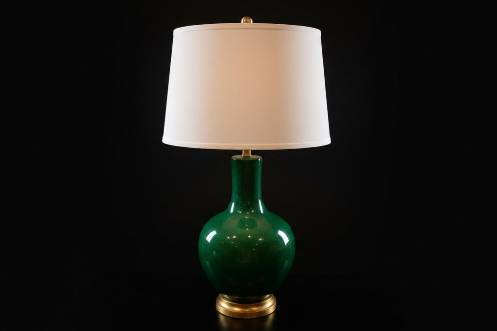 Citrine Home vintage emerald green crackle glaze porcelain lamp with a gold gilt base and white drum shade.