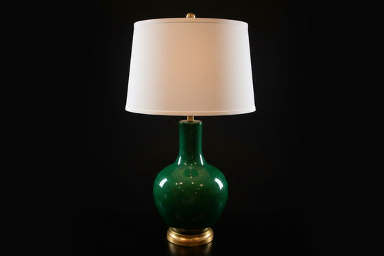 Citrine Home vintage emerald green crackle glaze porcelain lamp with a gold gilt base and white drum shade.
