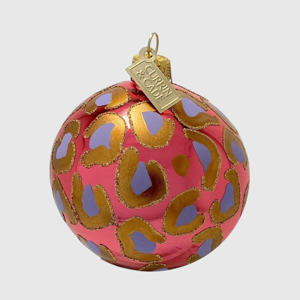Citrine Home mouth-blown glass Christmas ornament with coral and lavender leopard print and gold glitter details.