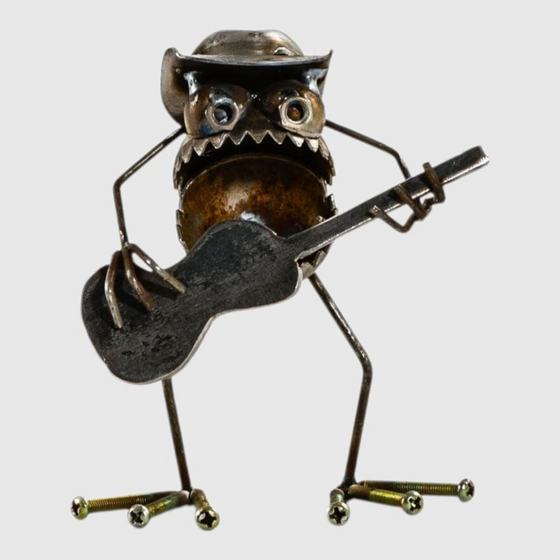 Citrine Home 6-inch metal cowboy figurine playing a guitar, crafted from recycled hardware and scrap metal parts.