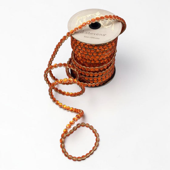 Citrine Home orange crown jewel ribbon trim on a spool, 0.5 inch wide decorative beaded craft ribbon.