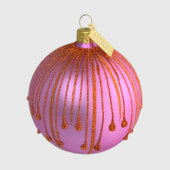 Citrine Home mouth-blown glass Christmas ornament in soft pink with butterscotch glitter drip details.