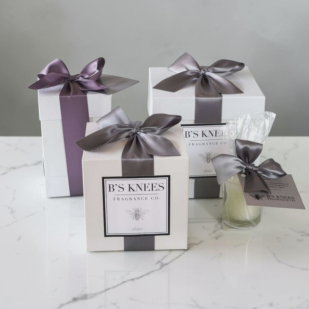 Citrine Home Slate 2-wick candle gift set in white boxes with grey satin ribbons on a marble surface