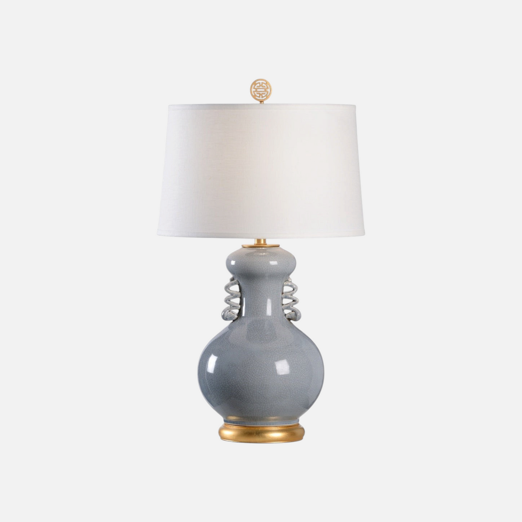 Citrine Home Chan table lamp with a slate gray crackle glazed ceramic body, gold base, and off-white drum shade.