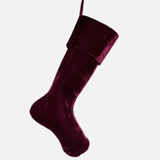 Citrine Home vintage French style deep burgundy velvet Christmas stocking hanging against a rustic wooden door