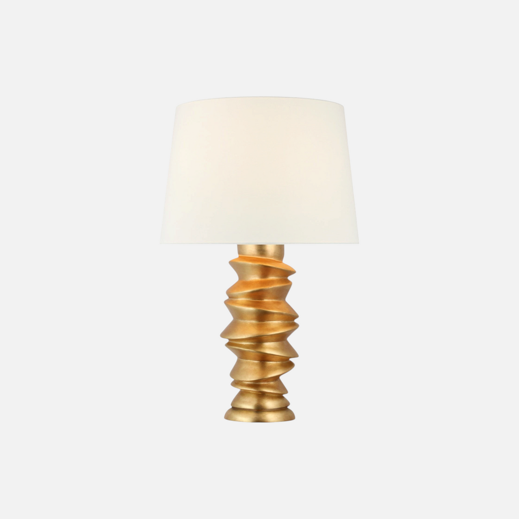 Citrine Home Karissa table lamp with a gold sculptural stacked base and a white tapered fabric shade.