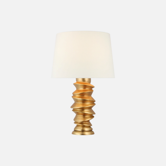 Citrine Home Karissa table lamp with a gold sculptural stacked base and a white tapered fabric shade.