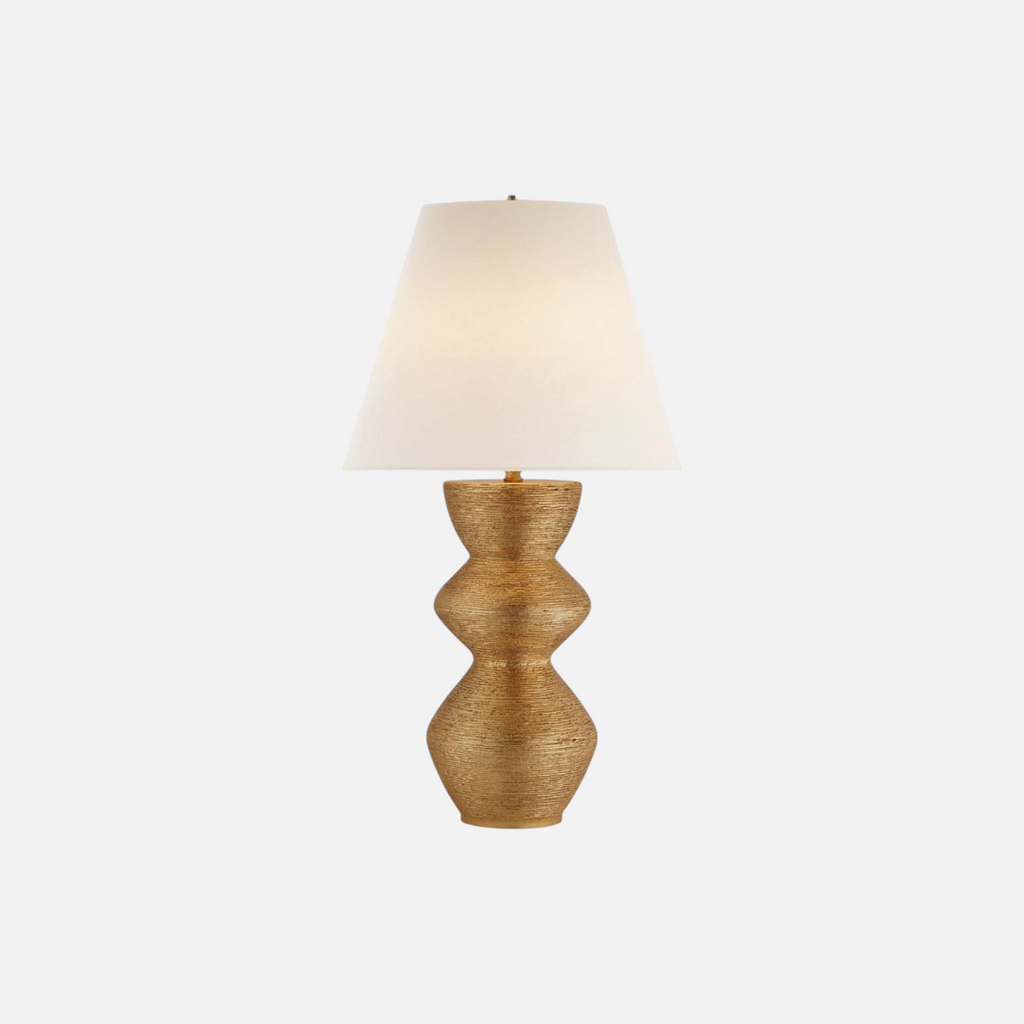 Citrine Home Utopia lamp featuring a gold striated metal base with organic topographic textures and a white shade